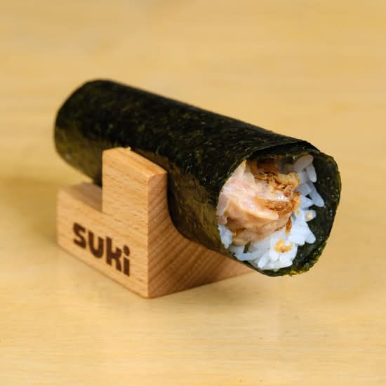 Spicy albacore handroll in a Suki wooden holder
